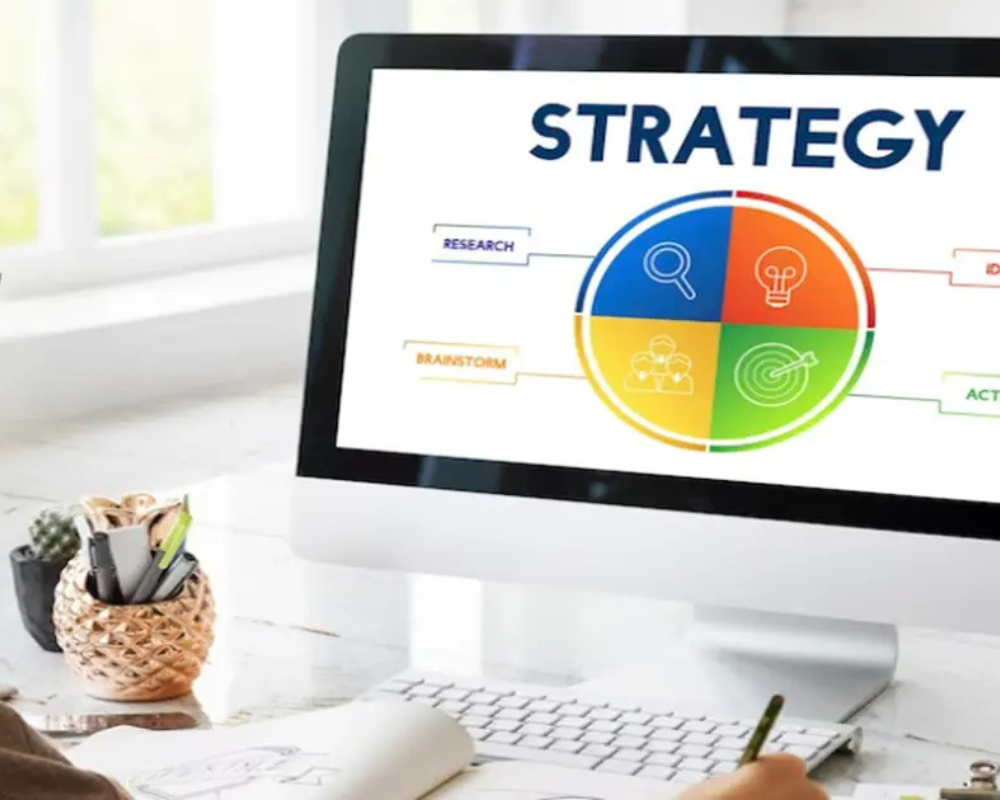 Computer that says Strategy with a pie chart underneath
